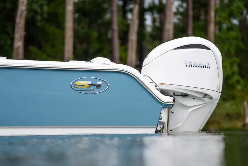 Slide: The Image of 2026 Sea Hunt Ultra 245 SE waste cap on textured boat surface. - 18