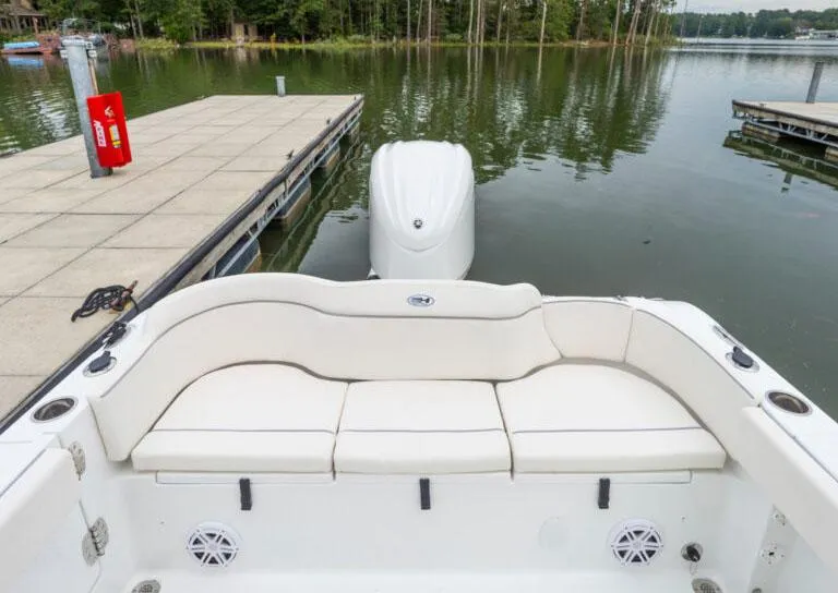 Slide: The Image of 2026 Sea Hunt Ultra 245 SE boat interior with helm and seating. - 5