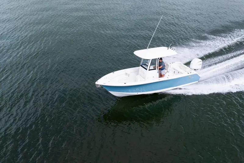 Slide: The Image of 2026 Sea Hunt Ultra 245 SE dashboard with Garmin navigation system and control panel. - 8