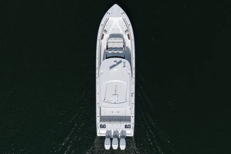 Slide: The Image of Overhead view of 2026 Everglades 455 Center Console boat on dark water. - 17