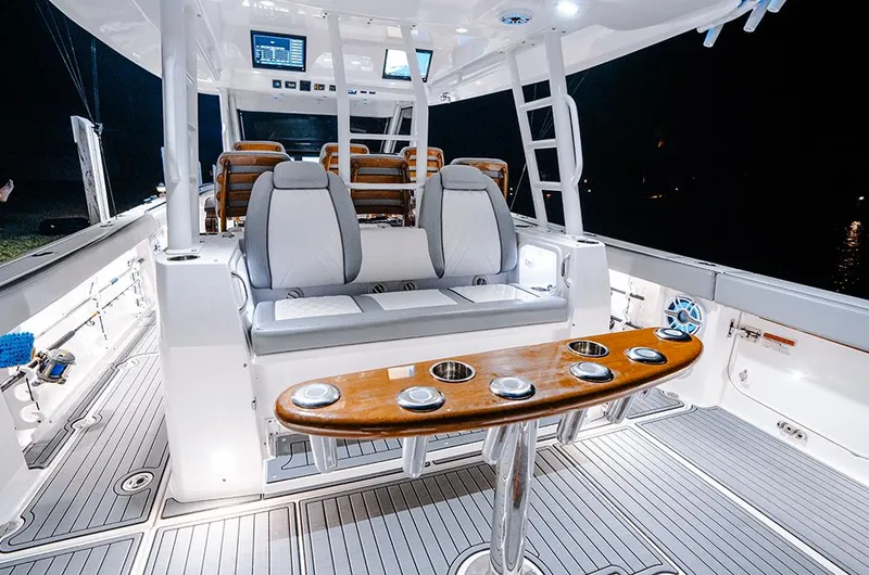 Slide: The Image of 2026 Everglades 455 Center Console boat cruising on a scenic waterway. - 6