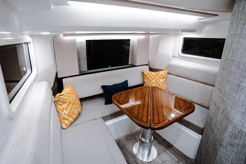 Slide: The Image of 2026 Everglades 455 Center Console boat with triple engines on a scenic waterway. - 8