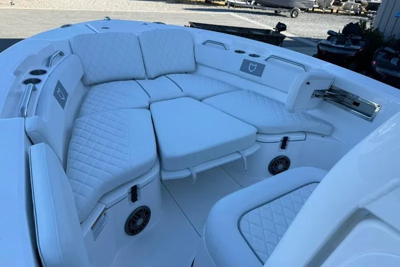 Slide: The Image of 2026 Sea Fox 228 Commander boat with luxurious white seating and cup holders. - 11