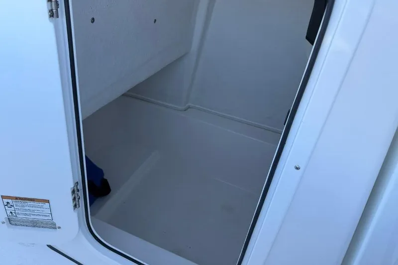Slide: The Image of Open storage compartment on 2026 Sea Fox 228 Commander boat. - 16