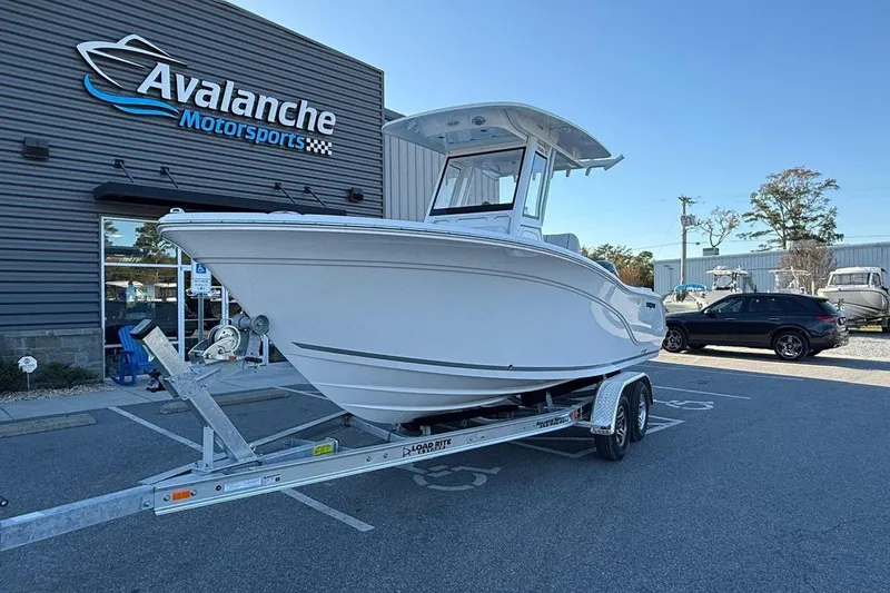 Slide: The Image of 2026 Sea Fox 228 Commander boat on trailer at Avalanche Motorsports dealership. - 2