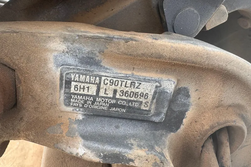 Slide: The Image of Rusty Yamaha C90TLRZ engine part with identification plate, made in Japan. - 9