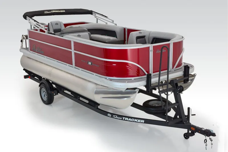 Slide: The Image of Manufacturer Provided Image: 2026 Sun Tracker Party Barge 18 DLX pontoon boat on trailer, red and silver design. - 30