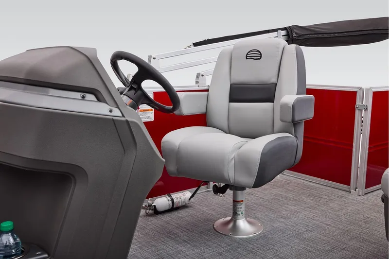 Slide: The Image of Manufacturer Provided Image: 2026 Sun Tracker Party Barge 18 DLX captain's chair and helm, featuring modern design. - 40