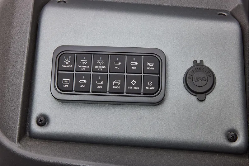 Slide: The Image of Manufacturer Provided Image: Control panel of 2026 Sun Tracker Party Barge 18 DLX with USB port and various switches. - 47