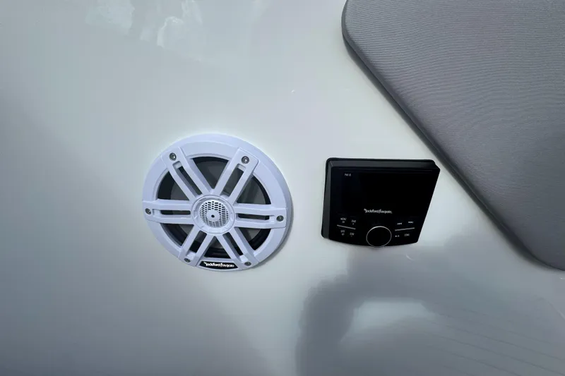 Slide: The Image of 2026 Cruisers Yachts 38 VTR boat interior with speakers, ocean view, and sleek design. - 14