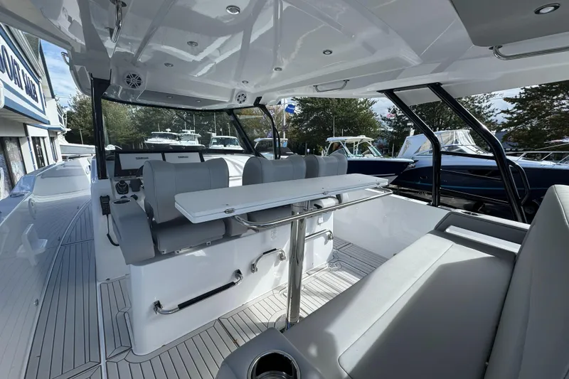 Slide: The Image of 2026 Cruisers Yachts 38 VTR cockpit with ocean view, featuring sleek design and modern amenities. - 15