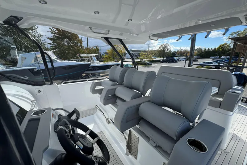 Slide: The Image of 2026 Cruisers Yachts 38 VTR cruising on a clear blue lake under a sunny sky. - 17