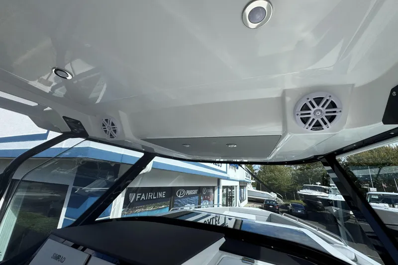 Slide: The Image of 2026 Cruisers Yachts 38 VTR cruising on open water, showcasing sleek design and comfort. - 20