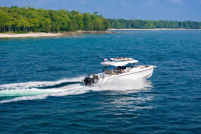 Slide: The Image of 2026 Cruisers Yachts 38 VTR with outdoor grill on deck, ocean view. - 6