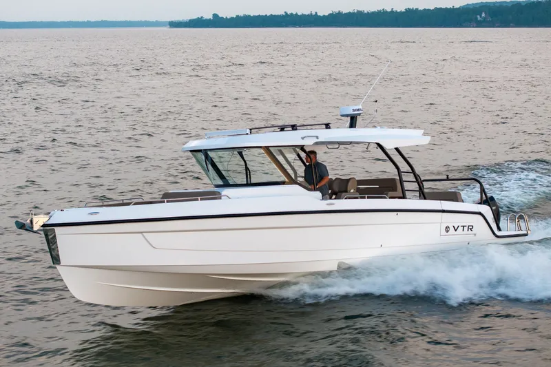 The Image of 2026 Cruisers Yachts 38 VTR boat displayed outdoors on stands. - 0