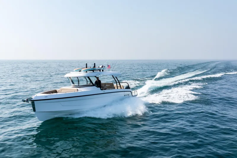 Slide: The Image of 2026 Cruisers Yachts 38 VTR boat displayed outdoors, clear sky background. - 1