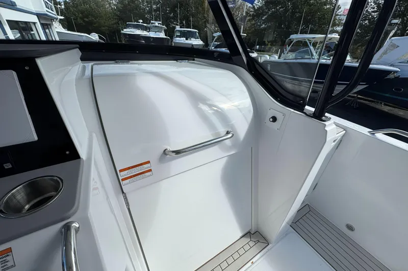 Slide: The Image of 2026 Cruisers Yachts 38 VTR cockpit with sleek white interior and modern design. - 21