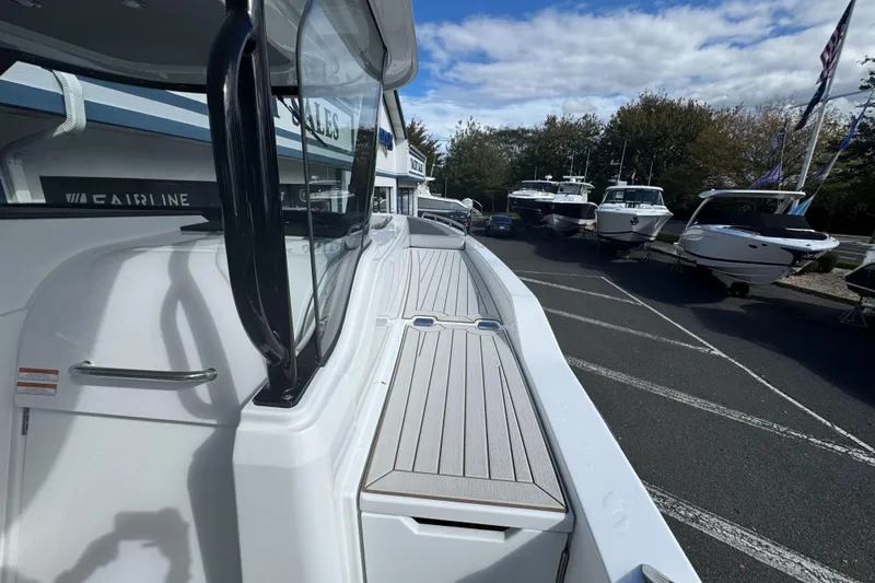 Slide: The Image of 2026 Cruisers Yachts 38 VTR docked, showcasing sleek design and spacious deck. - 23