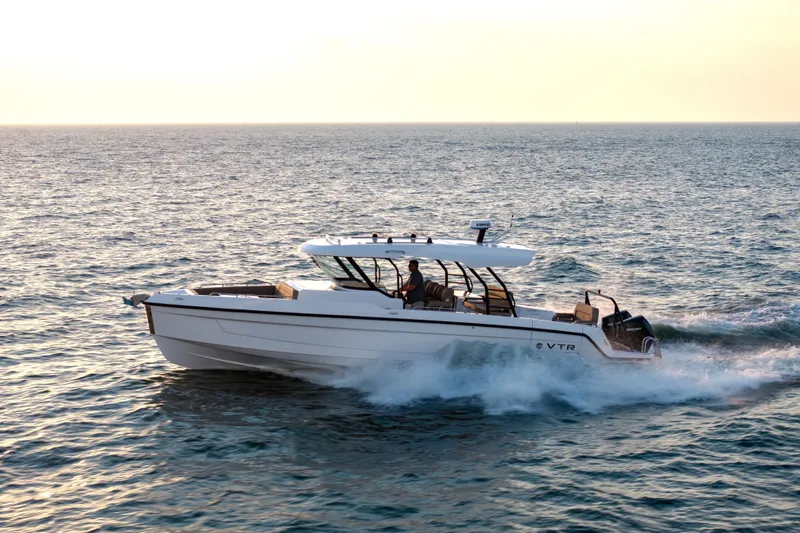 Slide: The Image of 2026 Cruisers Yachts 38 VTR, sleek white hull, docked outdoors. - 7