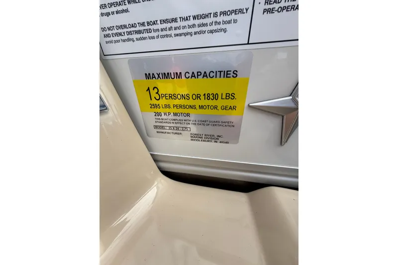 Slide: The Image of 2026 Berkshire 24RFC2 CTS 2.75 boat capacity label, max 13 persons or 1830 lbs. - 16