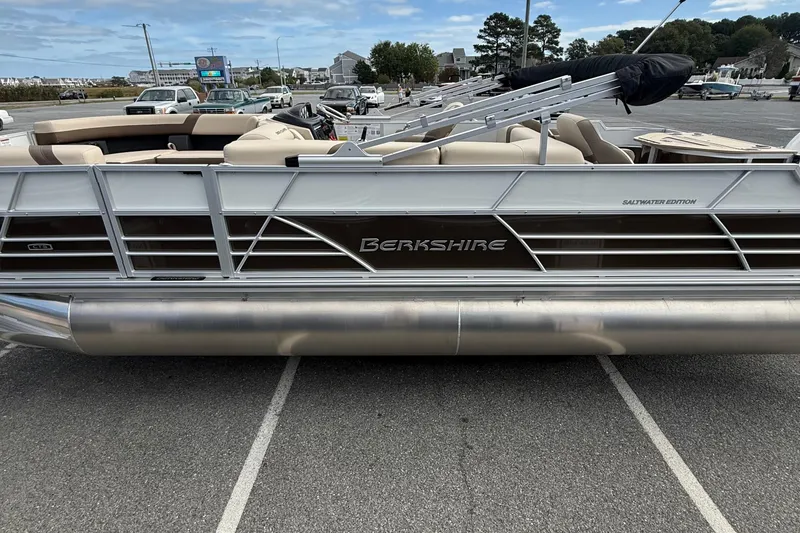 Slide: The Image of 2026 Berkshire 24RFC2 CTS 2.75 pontoon boat, saltwater edition, parked in a lot. - 5