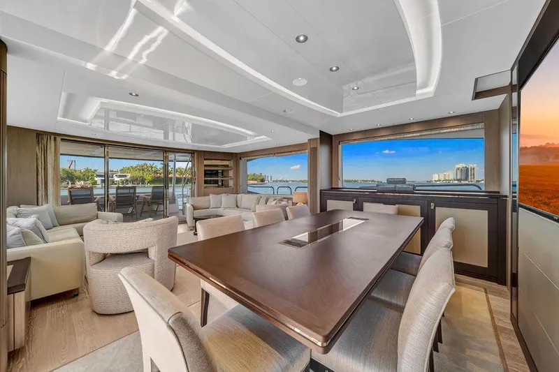 Slide: The Image of Luxurious interior of 2021 Sunseeker 86 Yacht with elegant dining area and panoramic windows. - 16