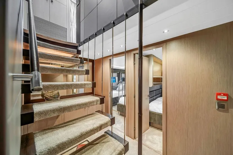 Slide: The Image of Luxurious interior of 2021 Sunseeker 86 Yacht with modern staircase and elegant cabin design. - 31