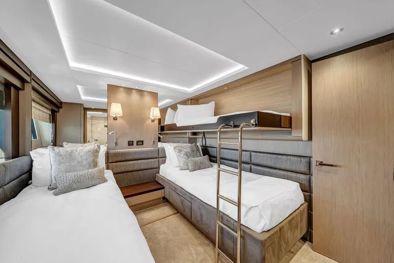 Slide: The Image of Luxurious cabin interior of 2021 Sunseeker 86 Yacht with modern twin beds and elegant lighting. - 42
