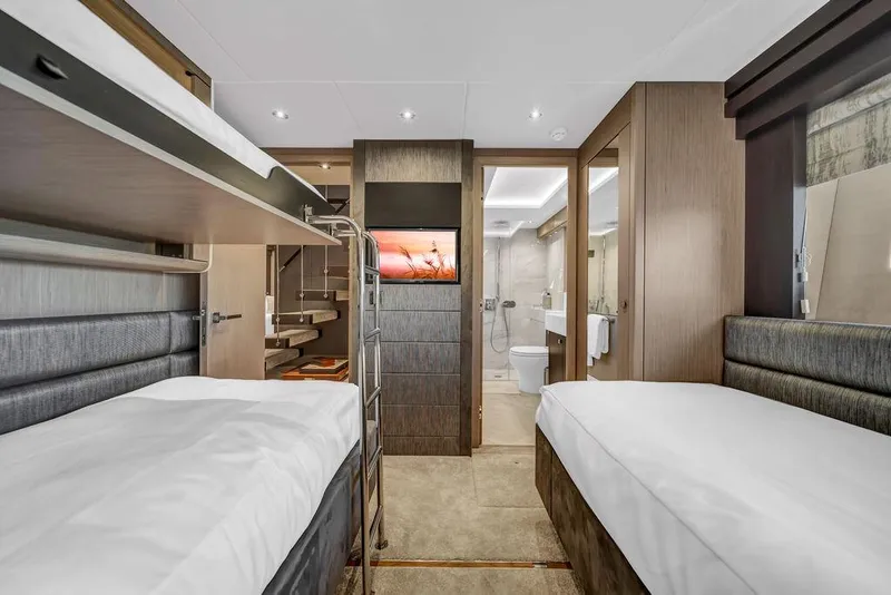Slide: The Image of Luxurious cabin interior of 2021 Sunseeker 86 Yacht with twin beds and modern decor. - 43