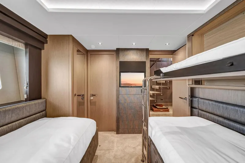 Slide: The Image of Luxurious cabin interior of 2021 Sunseeker 86 Yacht with twin beds and modern decor. - 44