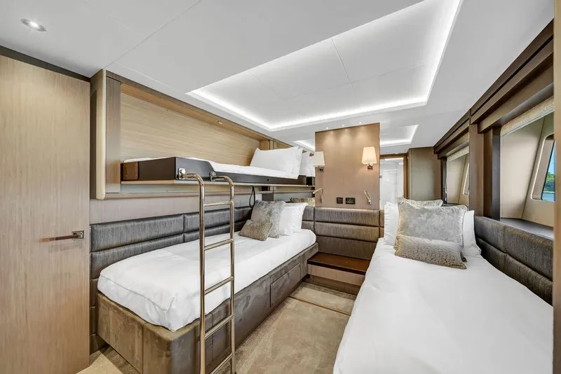 Slide: The Image of Luxurious cabin interior of 2021 Sunseeker 86 Yacht with modern twin beds and elegant decor. - 46