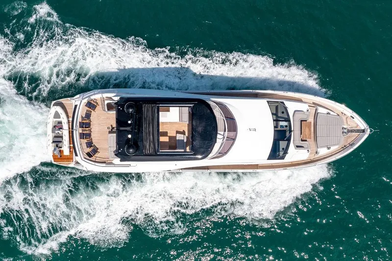 Slide: The Image of Sunseeker 86 Yacht 2021 cruising on open water, aerial view. - 7