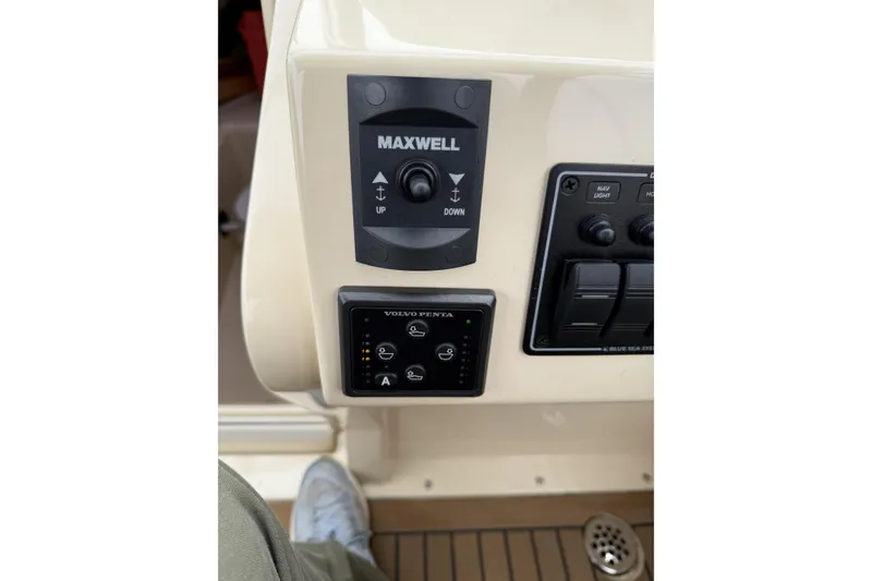 Slide: The Image of 2015 Rossiter 23 boat docked at marina with cover and canopy. - 12