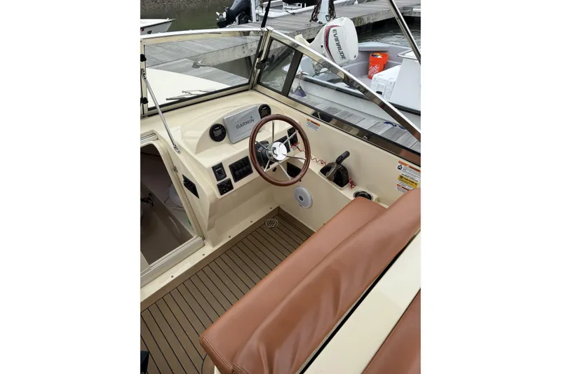 Slide: The Image of Luxurious brown leather seating on 2015 Rossiter 23 boat, featuring elegant design and craftsmanship. - 15