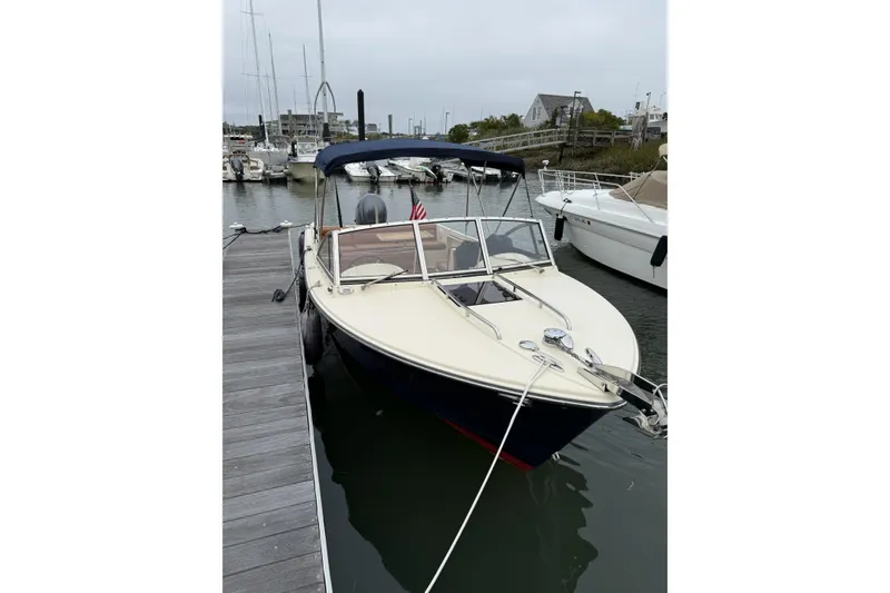 Slide: The Image of Control panel of a 2015 Rossiter 23 boat with Maxwell and Volvo Penta controls. - 21