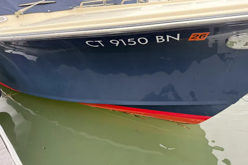 Slide: The Image of 2015 Rossiter 23 boat docked, displaying registration number CT 9150 BN. - 37
