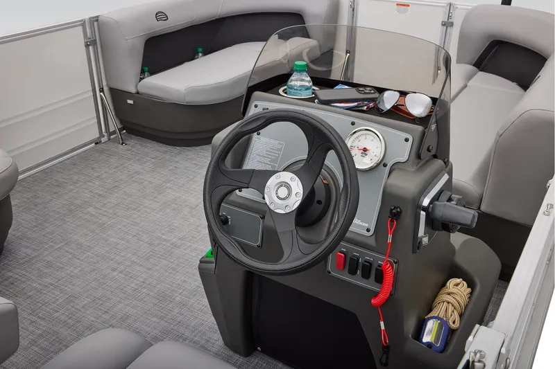 Slide: The Image of Manufacturer Provided Image: 2026 Sun Tracker Party Barge 16 DLX interior with steering console and seating. - 21