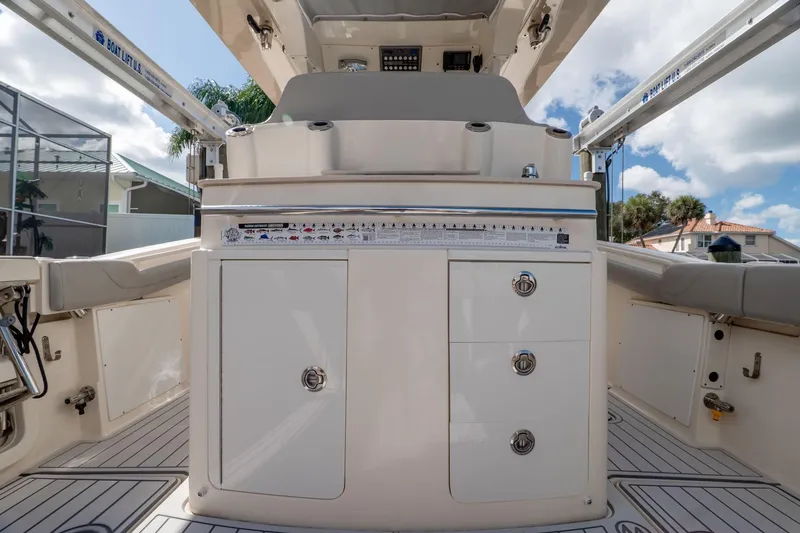 Slide: The Image of 2019 Scout 320 LXF boat interior with storage compartments and seating. - 18
