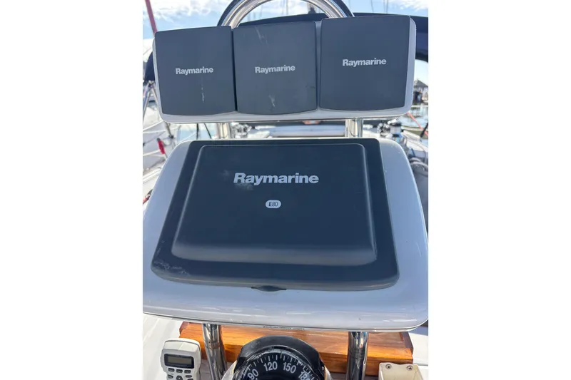 Slide: The Image of Cockpit of 2006 Catalina 320 sailboat with Raymarine navigation equipment. - 14