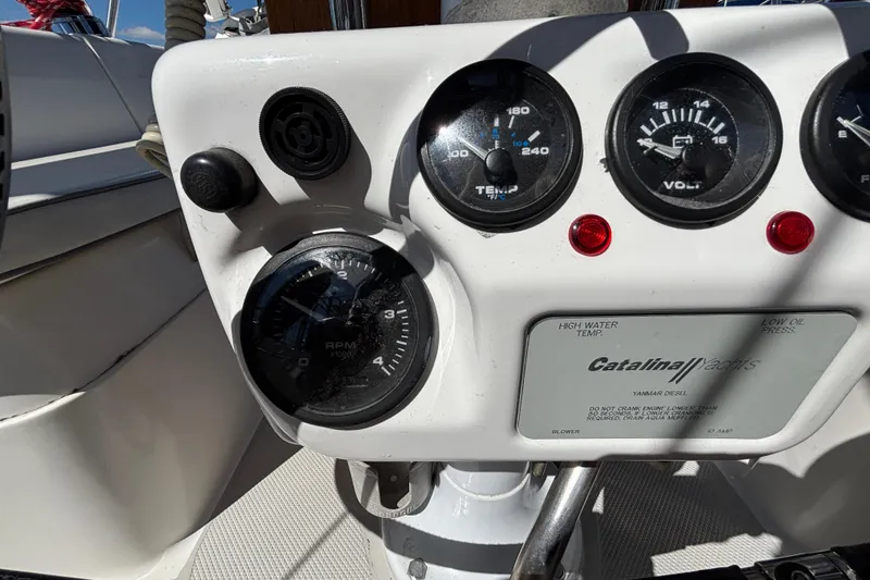 Slide: The Image of Control panel of a 2006 Catalina 320 sailboat with gauges and indicators. - 17