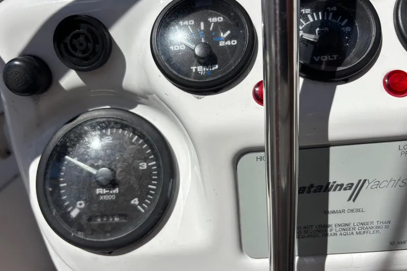 Slide: The Image of Close-up of 2006 Catalina 320 yacht dashboard with gauges and Yanmar Diesel label. - 18