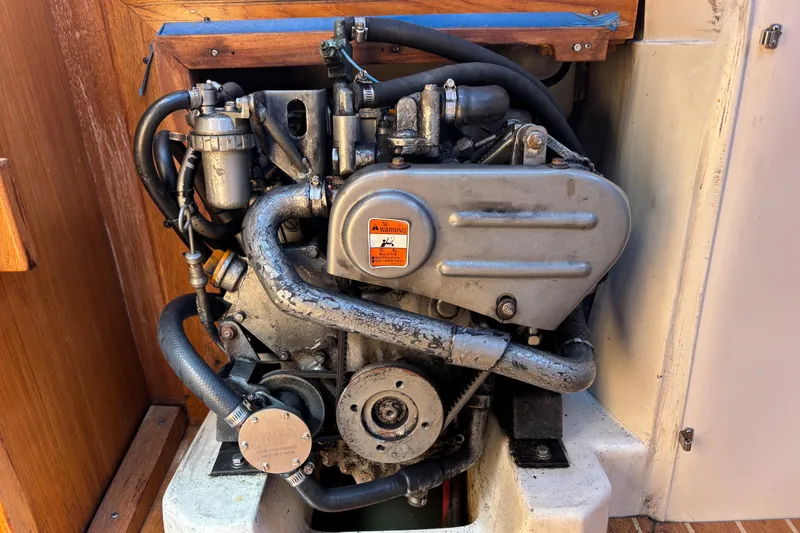 Slide: The Image of Catalina 320 2006 engine compartment, showcasing detailed mechanical components. - 34