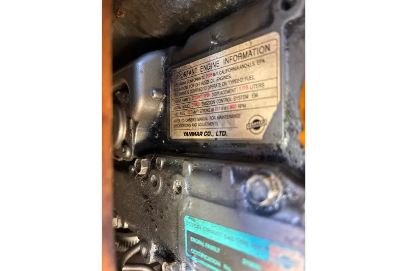 Slide: The Image of Catalina 320 2006 engine label, Yanmar model, technical specifications visible. - 35