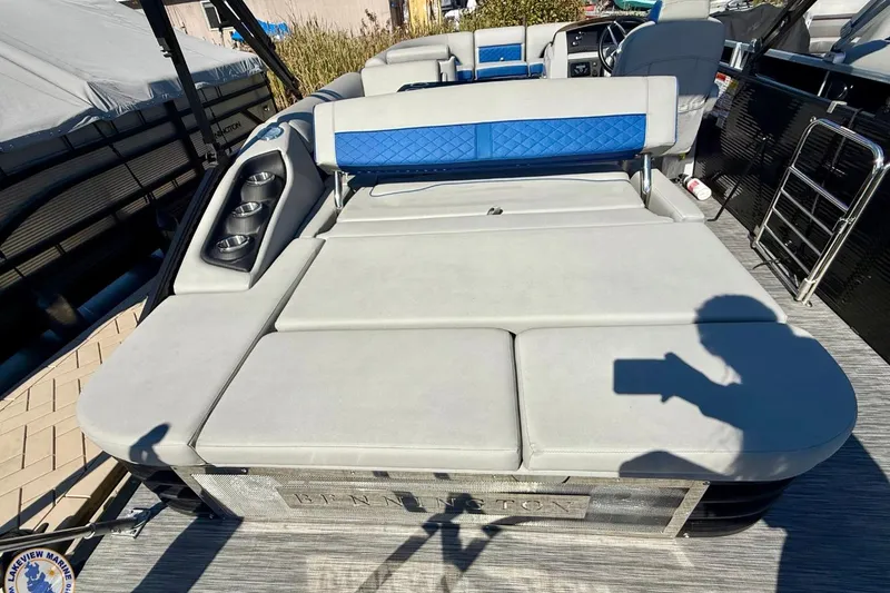 Slide: The Image of 2021 Bennington 22 LSB pontoon boat with spacious seating and cup holders. - 12