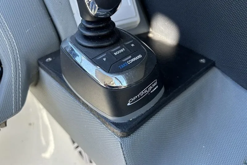 Slide: The Image of Optimus 360 joystick control in 2022 Cobalt 30SC Outboard boat cockpit. - 12