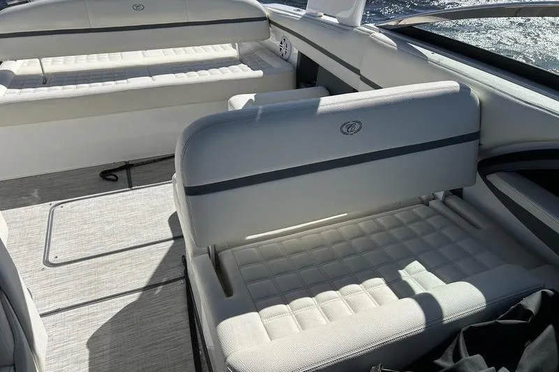 Slide: The Image of 2022 Cobalt 30SC Outboard boat interior with cushioned seating and sleek design. - 16