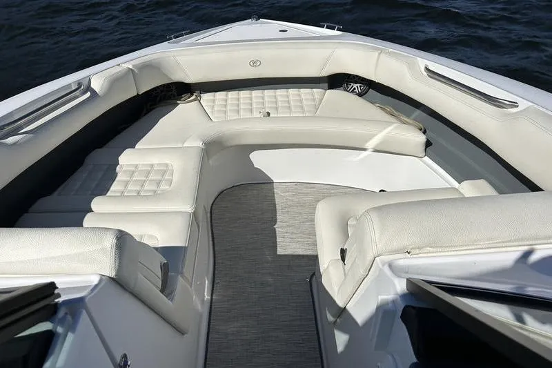Slide: The Image of Luxurious seating on 2022 Cobalt 30SC Outboard boat, featuring elegant white upholstery. - 8
