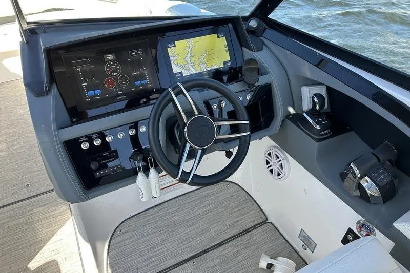 Slide: The Image of 2022 Cobalt 30SC Outboard helm with modern navigation and control systems. - 9