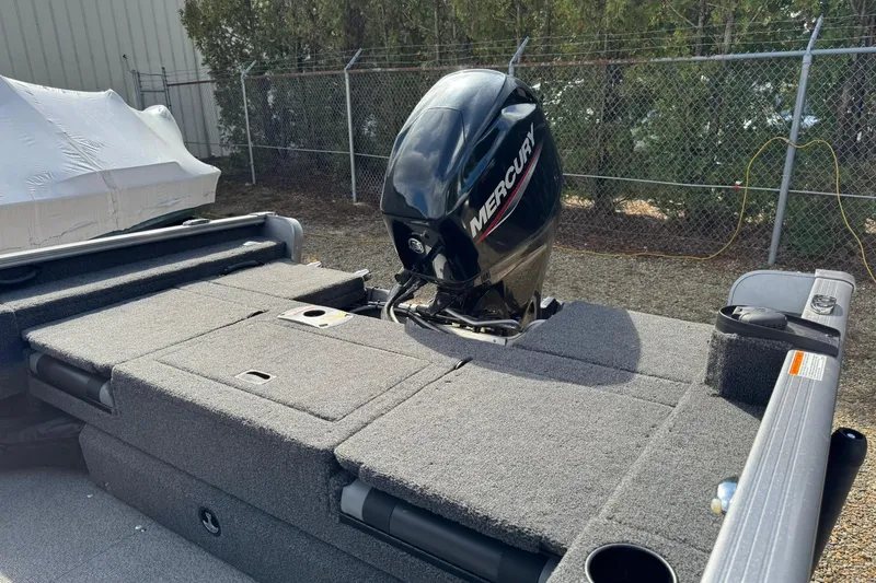 Slide: The Image of 2020 Lund 1675 Adventure Sport boat with Mercury outboard motor, parked outdoors. - 16