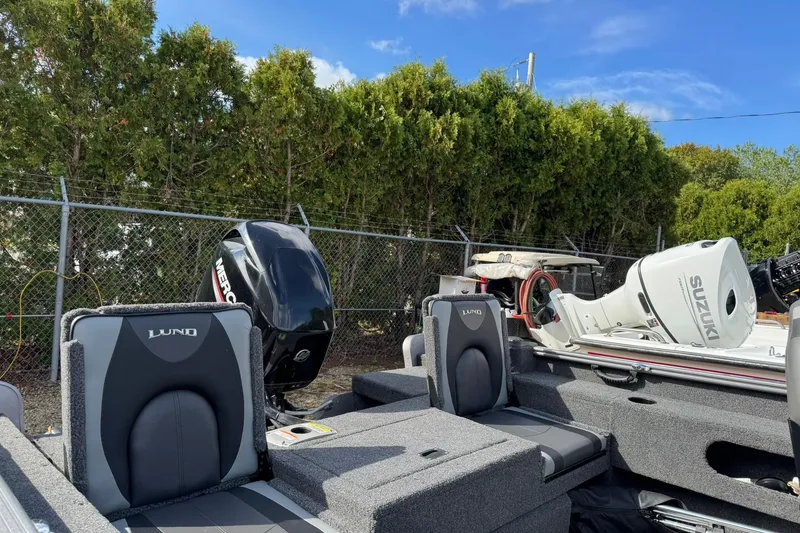 Slide: The Image of 2020 Lund 1675 Adventure Sport boat with Mercury and Suzuki engines, parked outdoors. - 18